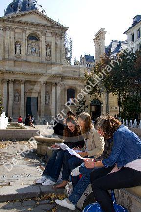 Students study near the Sorbonne in Paris, France.