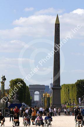 The Obelisk of Luxor located in the Place de la Concorde and the Arch de Triomphe at the west end of the Avenue des Champs-Elysees in Paris, France.