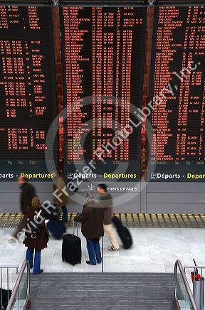 Departure board located in the Paris-Charles de Gaulle Airport, Paris, France.
