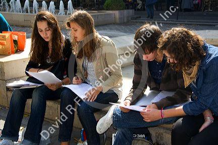 Students study near the Sorbonne in Paris, France.