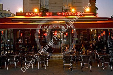 Cafe at dusk in the Latin Quarter of Paris, France.