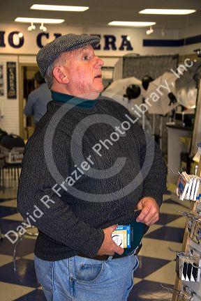 A thief shoplifting goods from a retail establishment in Boise, Idaho, USA. MR