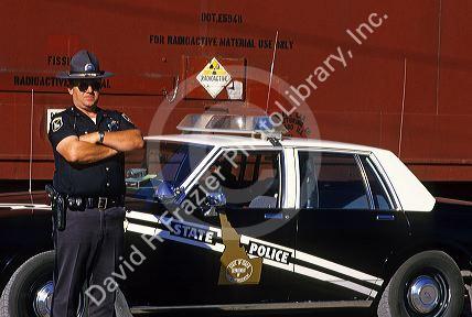 Idaho State Police officer guards a train carrying nuclear waste before returning it to Colorado.