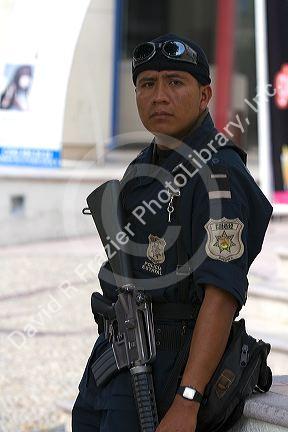 Mexican police officer with gun in Acapulco, Guerrero, Mexico.