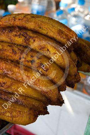 Street vendor selling roasted bananas in Acapulco, Guerrero, Mexico.