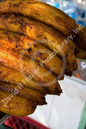 Street vendor selling roasted bananas in Acapulco, Guerrero, Mexico.