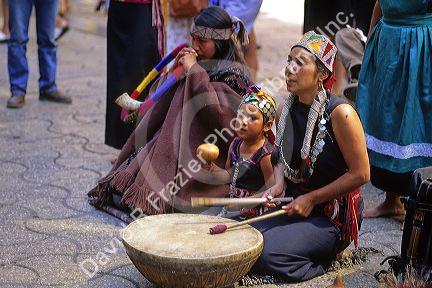 Mapuche indian people playing traditional music in Santiago, Chile.