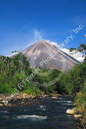 Arenal Volcano and fresh water stream near La Fortuna, San Carlos, Costa Rica.