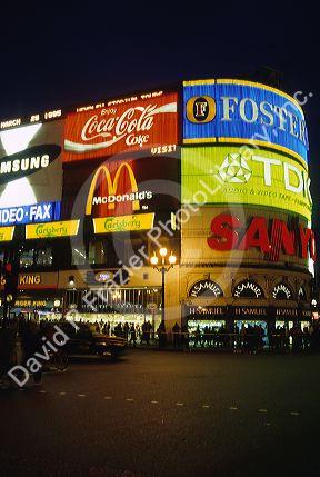 Large electronic signs on the sides of buildings in Piccadilly Circus, London, England.