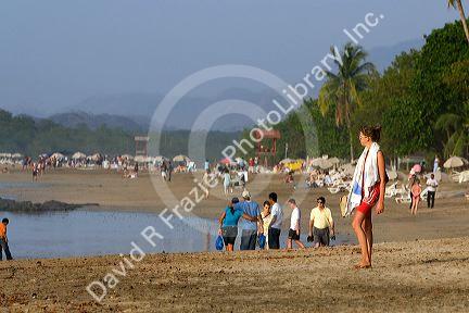 People on the beach at Tamarindo on the Northern Pacific Coast of Costa Rica.