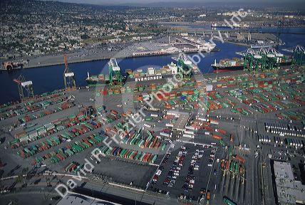 Container yard with ships at Port of Long Beach, California.