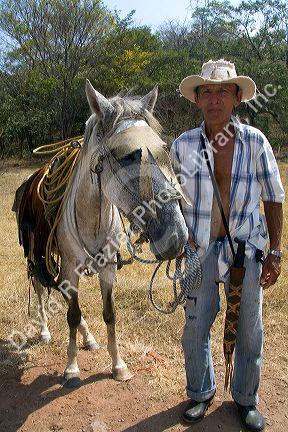 Costa Rican farmer with his horse near the town of Nicoya, Costa Rica. MR