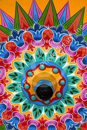 Carretas are elaborately painted oxcarts in the city of Sarchi Norte, Cosat Rica.  This view is a detail of a wheel.
