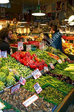Vendor selling produce at the Pike Place Market in Seattle, Washington, USA.