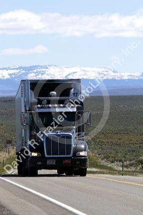 Transport truck traveling on Highway 95 near Jordan Valley, Oregon, USA.