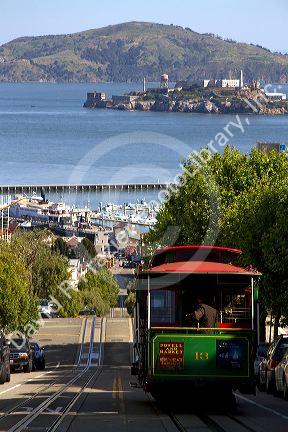Cable car and Alcatraz Island in San Francisco, California, USA.
