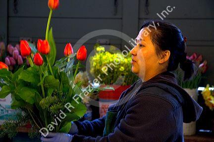 Fresh flower vendor at the Pike Place Market in Seattle, Washington, USA.