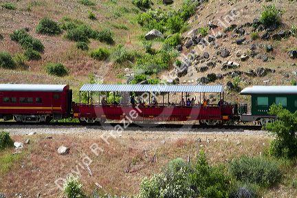 The Thunder Mountain Line scenic tourist train traveling along the Payette River between Horseshoe Bend and Banks, Idaho, USA.