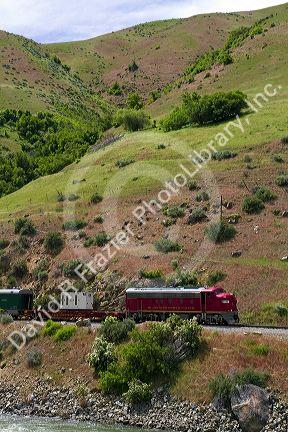 The Thunder Mountain Line scenic tourist train traveling along the Payette River between Horseshoe Bend and Banks, Idaho, USA.