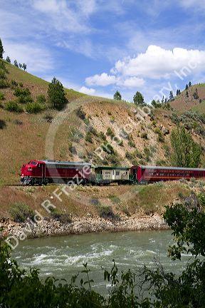 The Thunder Mountain Line scenic tourist train traveling along the Payette River between Horseshoe Bend and Banks, Idaho, USA.