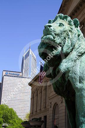 Bronze lion statue at the entrance to the Art Institute of Chicago building in Chicago, Illinois, USA.