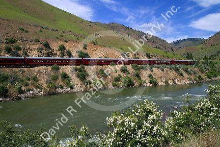 The Thunder Mountain Line scenic tourist train traveling along the Payette River between Horseshoe Bend and Banks, Idaho, USA.
