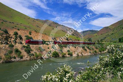 The Thunder Mountain Line scenic tourist train traveling along the Payette River between Horseshoe Bend and Banks, Idaho, USA.