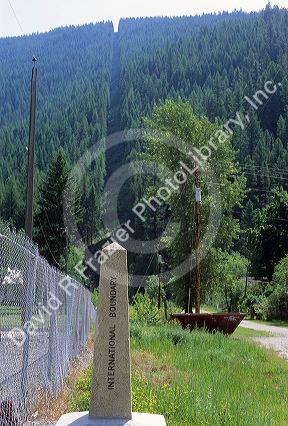A marker that shows the international boundary of the United States of America and Canada border in East Port, Idaho.