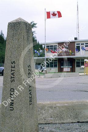 A marker that shows the international boundary of the United States of America and Canada border in East Port, Idaho and Kingston, B.C.