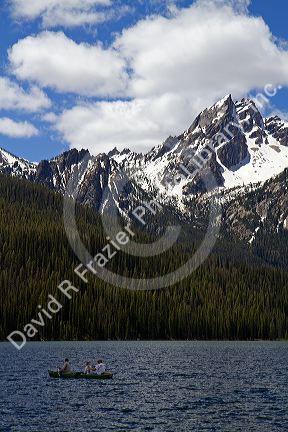 Canoeing on Stanley Lake in the Sawtooth Mountain Range near Stanley, Idaho, USA.