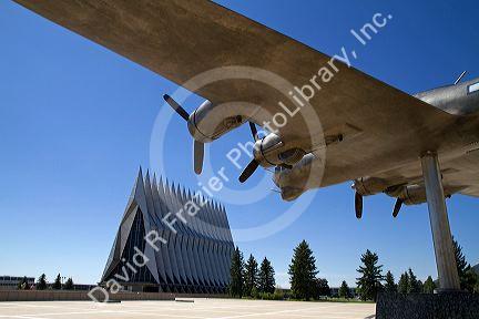 Bronze sculpure of vintage WW11 aircraft in front of the Cadet Chapel at the Air Force Academy in Colorado Springs, Colorado, USA.