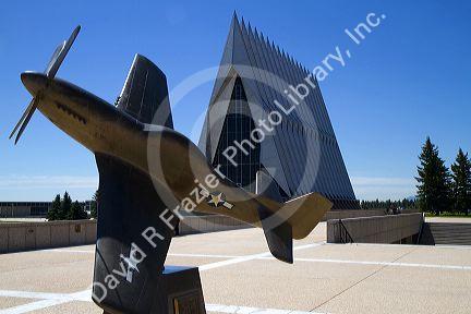 Bronze sculpure of vintage WW11 aircraft in front of the Cadet Chapel at the Air Force Academy in Colorado Springs, Colorado, USA.