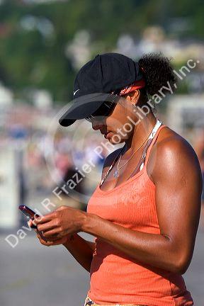 African american woman text messaging on her cell phone in Seattle, Washington. MR