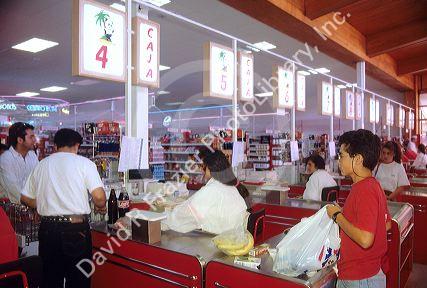 People checking out at a grocery store in Chile.