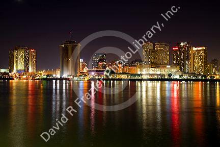 Night skyline of the city of New Orleans along the Mississippi River, Louisiana, USA.