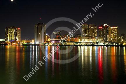 Night skyline of the city of New Orleans along the Mississippi River, Louisiana, USA.