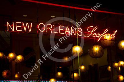 Neon sign advertising New Orleans seafood in the French Quarter of New Orleans, Louisiana, USA.