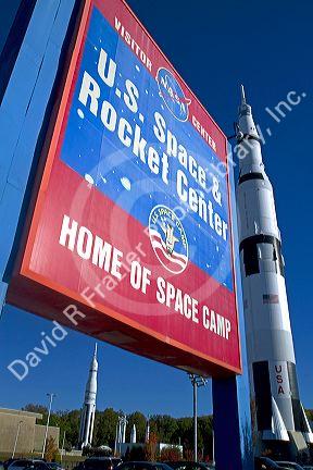 Saturn V mock-up stands next to the U.S. Space and Rocket Center sign located in Huntsville, Alabama, USA.