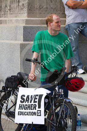 Demonstrator protesting educational funding cuts on the steps of the state capitol building in Baton Rouge, Louisiana, USA.
