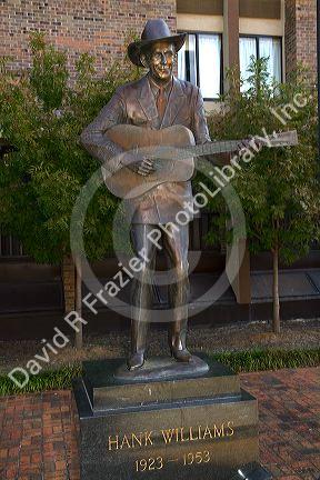 Life-size bronze statue of Hank Williams stands in downtown Montgomery, Alabama, USA.