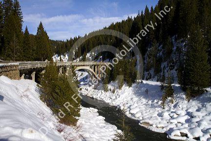 The Rainbow Bridge spanning the North Fork of the Payette River during winter, Valley County, Idaho, USA.
