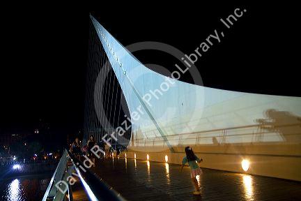 The Puente de la Mujer footbridge at night in the Puerto Madero district of Buenos Aires, Argentina.