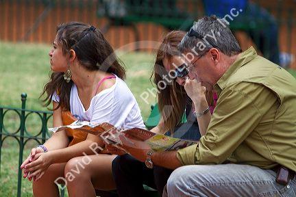 Tourists look at a map in Buenos Aires, Argentina.