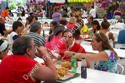 People dine on seafood and paella at a Fisherman Festival in Mar del Plata, Argentina.