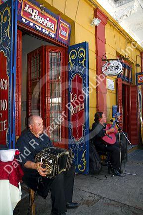 Argentine man playing the accordion in the La Boca barrio of Buenos Aires, Argentina.