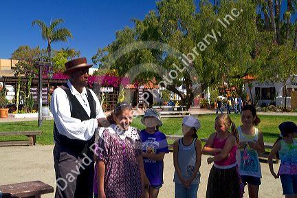 Children on a guided tour of Old Town San Diego State Historic Park, California, USA.