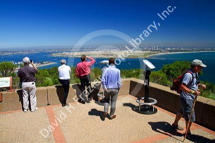 Tourists at a scenic overlook of San Diego and Coronado Island from Point Loma, California, USA.