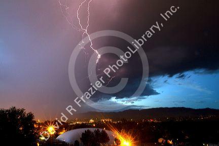 Lightning strikes during a thunderstorm on the first day of summer in Boise, Idaho, USA.