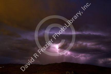Lightning strikes during a thunderstorm on the first day of summer in Boise, Idaho, USA.