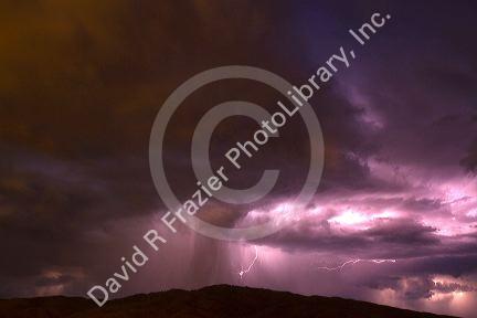 Lightning strikes during a thunderstorm on the first day of summer in Boise, Idaho, USA.